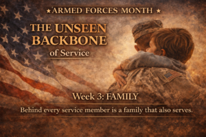 A sepia-toned Armed Forces Month graphic showing a military service member embracing a child in front of a faded American flag, with the text “The Unseen Backbone of Service – Week 3: Family.”